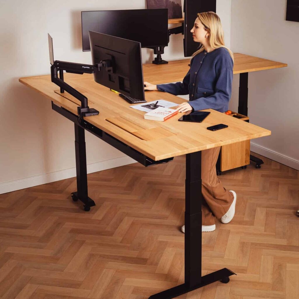 view of our own purchase testing minimalist home office setup l shaped desk dual monitor setup unboxing package arrival several weeks to months 